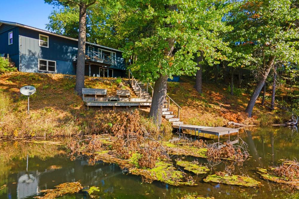 Antiquing and Fishing Riverfront Waupaca Home!